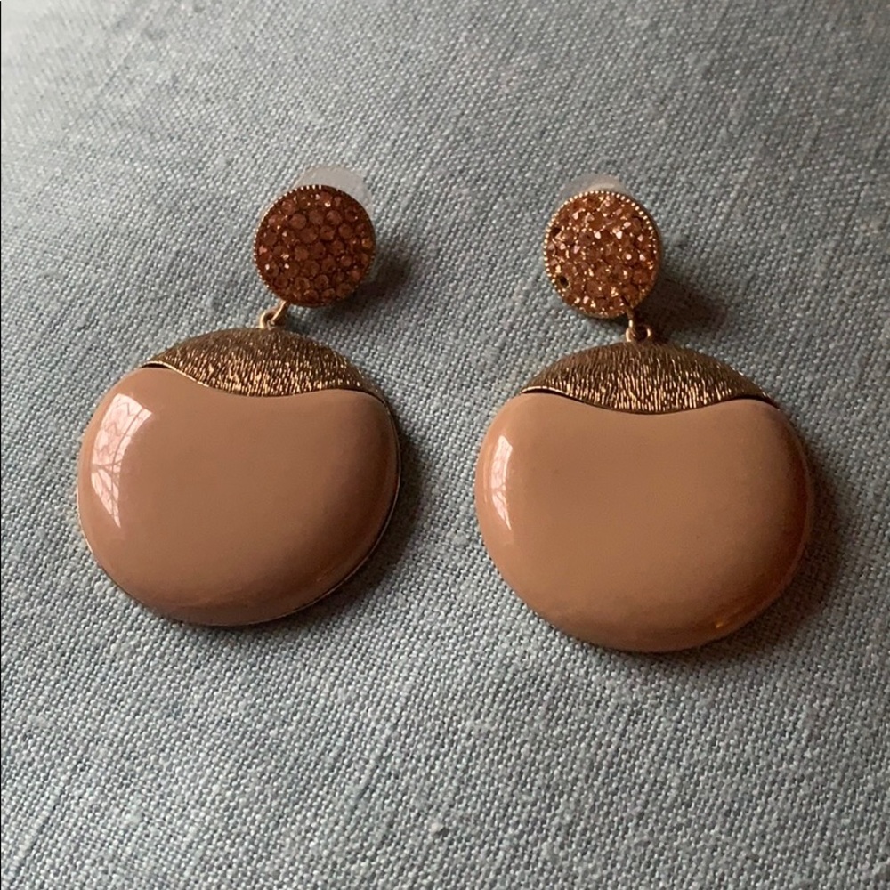 Beige and gold colored statement earrings